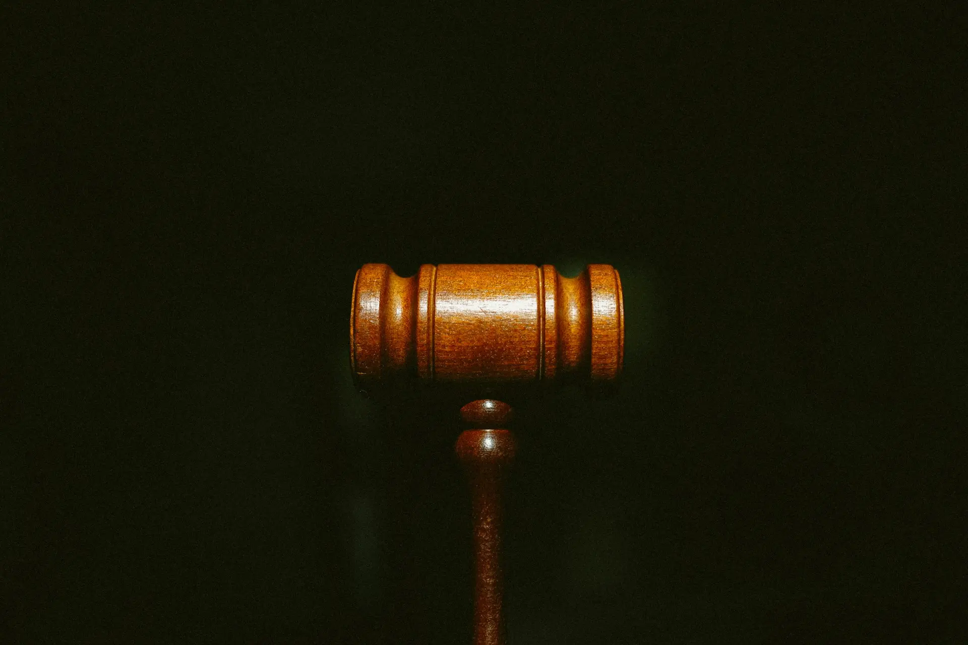 brown wooden stand with black background